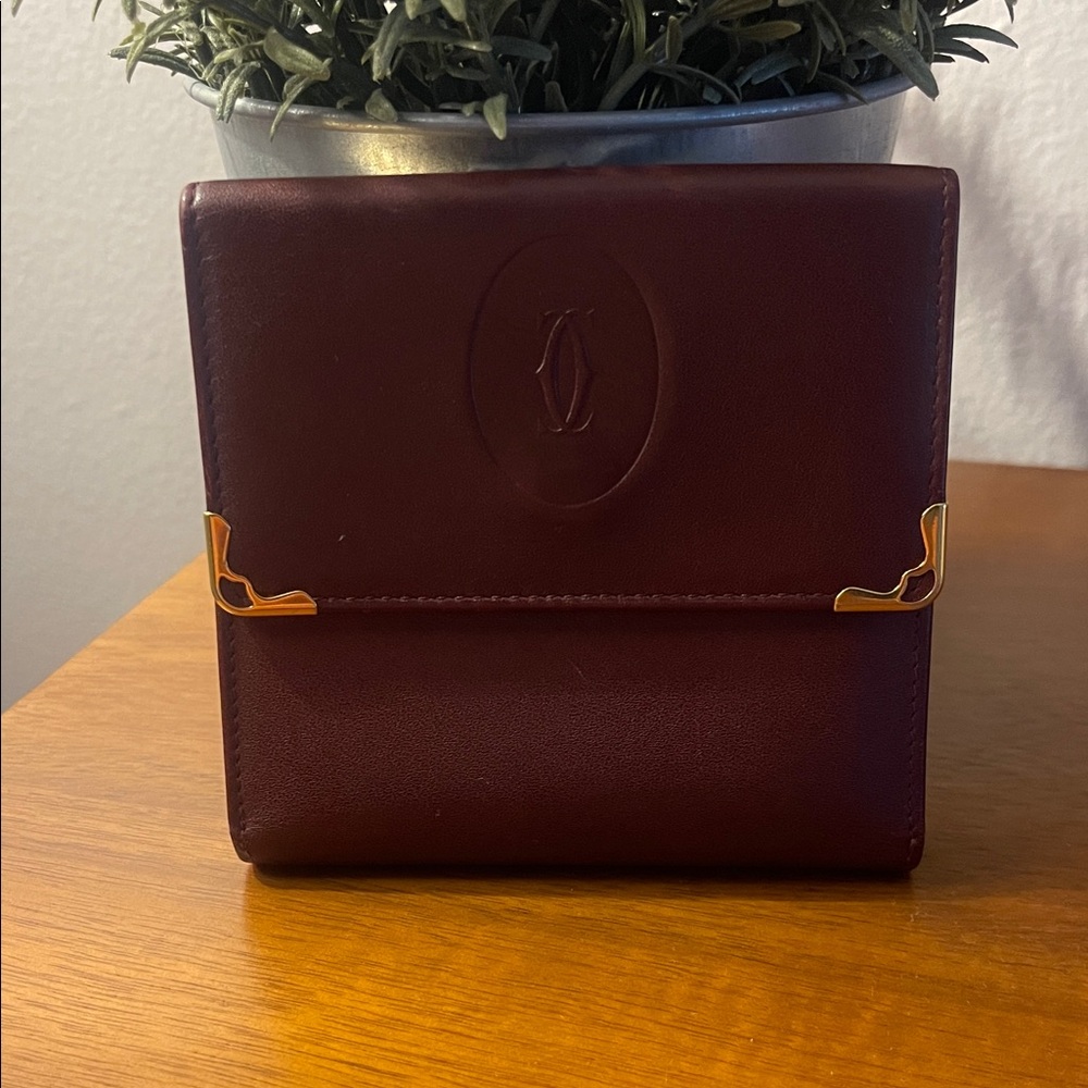 Cartier Wallet in Burgundy Leather with Gold Accents